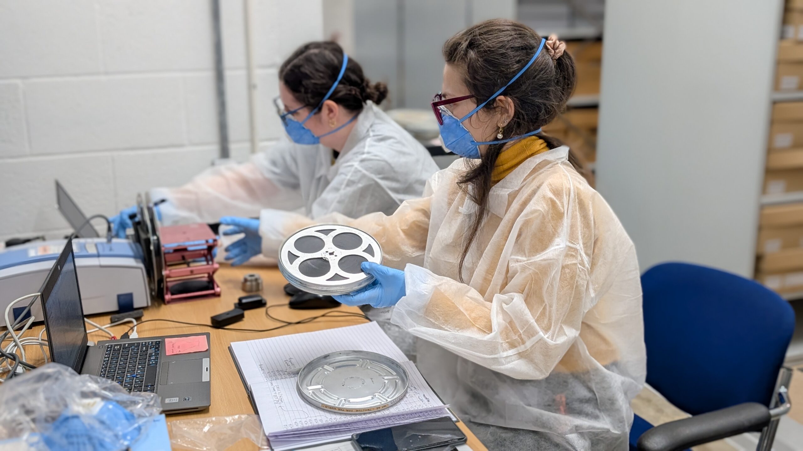 Researchers analysing film.
